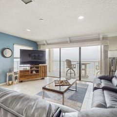 Coastal condo with sweeping Gulf views and wraparound balcony dogs welcome