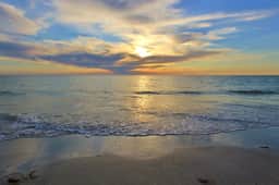Beach chic condo across from beach close to John s Pass on site pool dogs ok