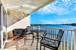 Waterfront condo with shared heated pool and splendid views Dogs ok