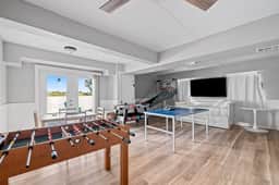 Sprawling river view estate with game room dock kayaks grill and fishing gear