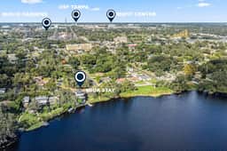 Sprawling river view estate with game room dock kayaks grill and fishing gear