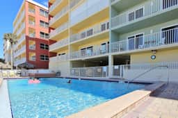 Oceanfront condo with heated pool hot tub and grills