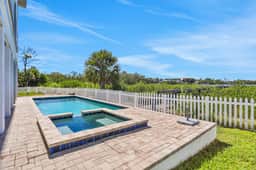 Luxurious waterfront home with pool game room dock