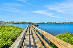 Luxurious waterfront home with pool game room dock