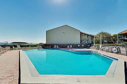 Top floor Condo with on site pool hot tub grills gym and private balcony