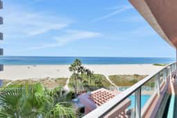 Beachfront condo with multiple balconies heated pool gym hot tub and AC