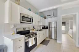 Enchanting condo with full kitchen enclosed yard and washer dryer