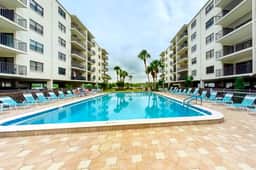 Coastal condo with beach and pool access balcony WD central air and water views