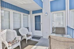 Water view condo with balcony heated pool and WD walk to beach