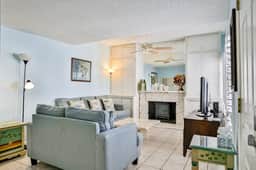 Water view condo with balcony heated pool and WD walk to beach