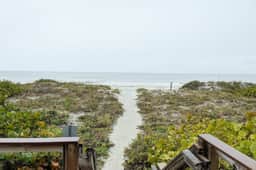 Beachside Haven with Private Balcony Free WiFi Washer Dryer Shared Pool Central AC