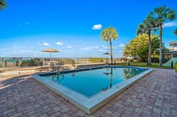 Gorgeous updated and spacious condo with stunning beachfront view pool WD and AC