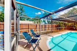 Coastal home with pool lanai patio and fireplace
