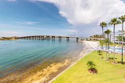 Water view condo with private beach pool and hot tub snowbird friendly