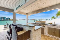 Chic waterfront retreat with private pool and outdoor kitchen near the beach