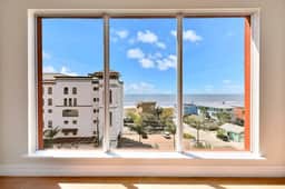Bay front condo shared pool and hot tub right next to the beach