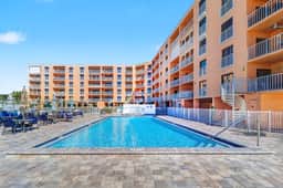 Beachfront condo with pool tennis court and AC Dog friendly
