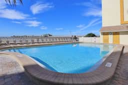 Custom beachfront condo w private balcony views heated pool hot tub AC