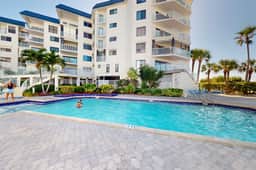 4th floor beachfront beauty with pool and peekaboo Gulf Views walk to waves