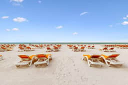 City View condo with beach access pools hot tub gym AC and WD