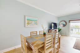 Water view condo with pool hot tub pier private balcony AC and washer dryer