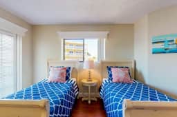 Sunny beachfront condo with pool access to beach attractions