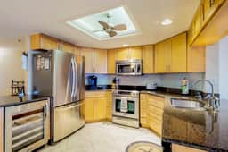 Sunny beachfront condo with pool access to beach attractions