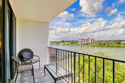 Waterfront condo with pool and spa directly across from wide beach