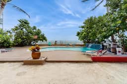 1st floor beachfront condo with outdoor pool with views AC and WD