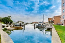 Intracoastal view condo with pool hot tub and marina access walk to beach