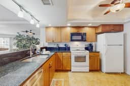 Beachfront condo with balcony pool hot tub grill and AC