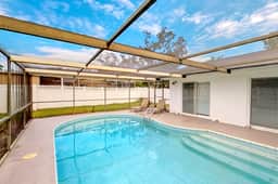 Bright and open home with private pool screened lanai enclosed yard and WD