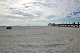 Seashore getaway with partial Gulf view and beachfront heated pool and spa