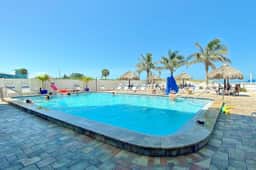 Newly renovated condo w private balcony gas grill and on site heated pool AC