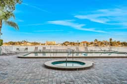 Top floor condo near the beach with pool hot tub washer dryer