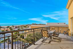 Top floor condo near the beach with pool hot tub washer dryer