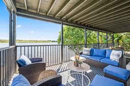 Sprawling river view estate with game room dock kayaks grill and fishing gear - Image 4