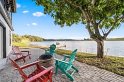 Sprawling river view estate with game room dock kayaks grill and fishing gear - Image 3