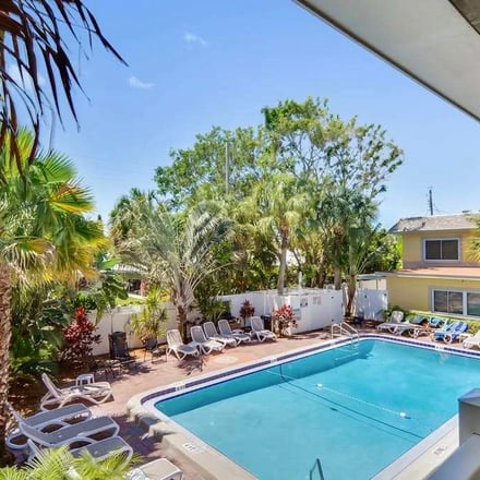 Tropical pool courtyard viewed from balcony at St. Pete Beach
