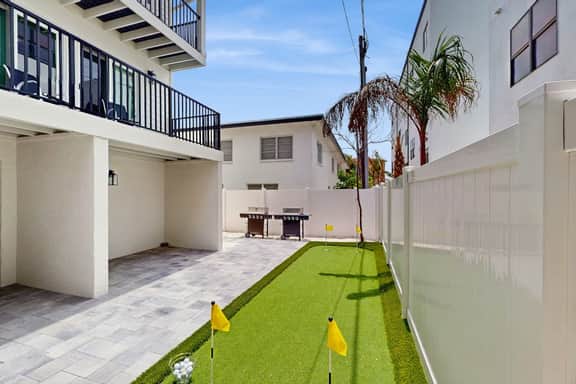 Family and dog friendly steps to the Gulf and beaches shared putting green AC