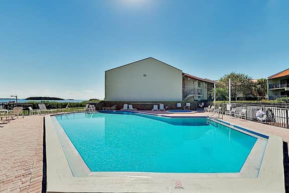 Top floor Condo with on site pool hot tub grills gym and private balcony