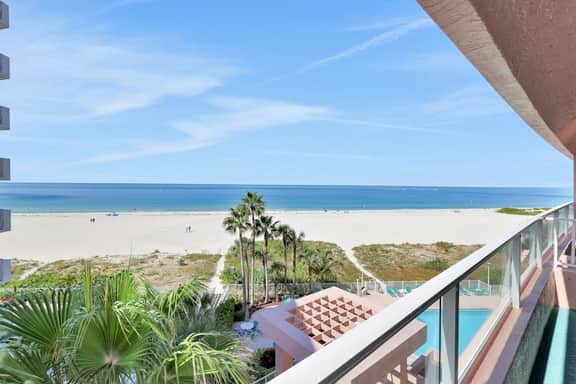 Beachfront condo with multiple balconies heated pool gym hot tub and AC