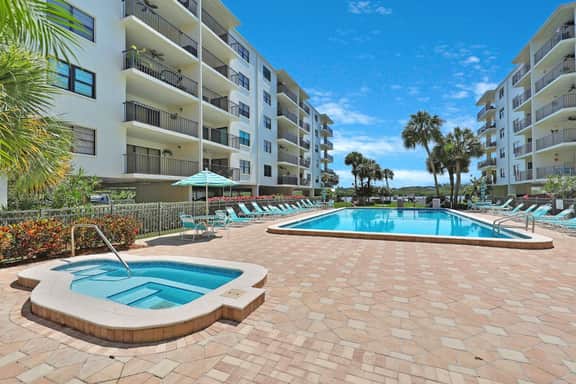Light and airy condo with balcony pool hot tub and beach access