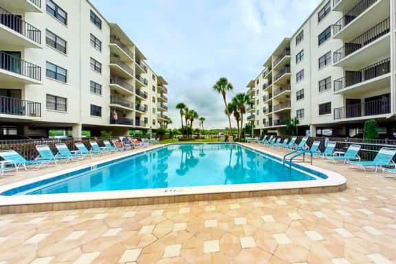 Coastal condo with beach and pool access balcony WD central air and water views