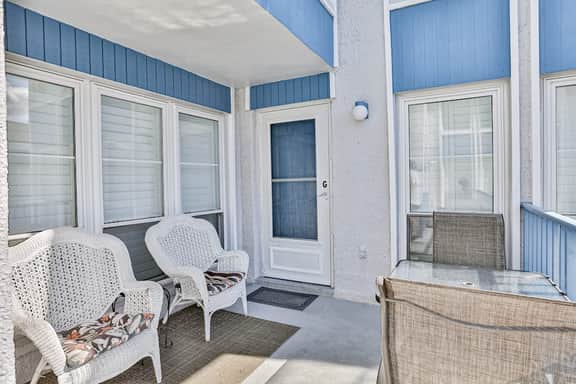 Water view condo with balcony heated pool and WD walk to beach