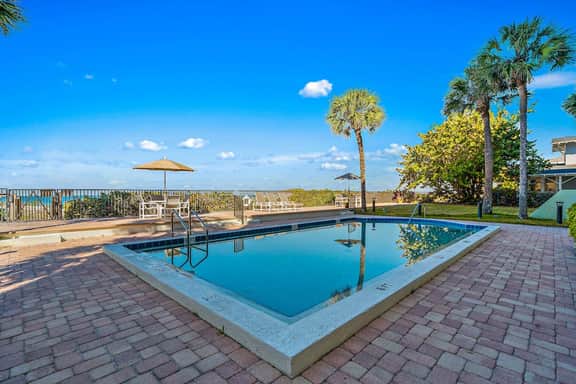 Gorgeous updated and spacious condo with stunning beachfront view pool WD and AC