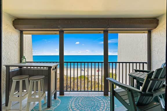 Gorgeous updated and spacious condo with stunning beachfront view pool WD and AC