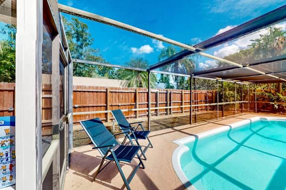 Coastal home with pool lanai patio and fireplace