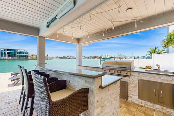 Chic waterfront retreat with private pool and outdoor kitchen near the beach