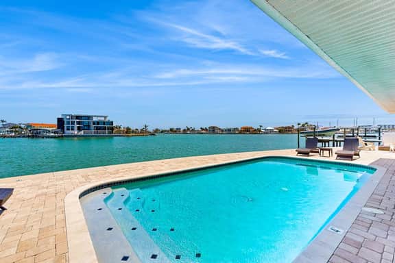 Chic waterfront retreat with private pool and outdoor kitchen near the beach